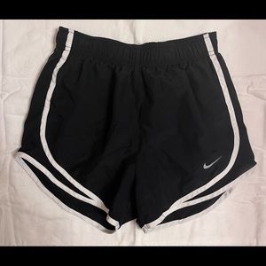 Black with white stripes - Nike women’s running shorts.